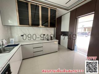 Modern kitchen with ample cabinetry and natural light