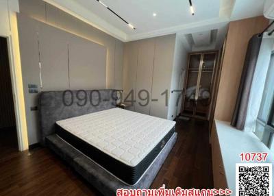 Contemporary bedroom with double bed and stylish interior design