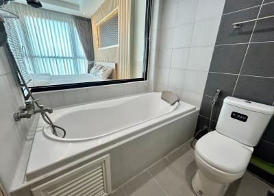 Modern bathroom with bathtub and natural light