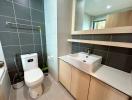 Modern bathroom with wooden cabinets and ceramic fittings