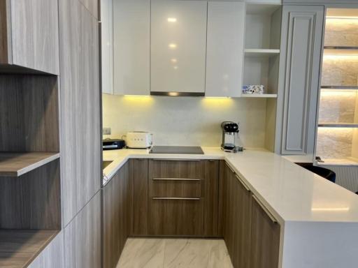 Modern kitchen with stainless steel appliances and wooden cabinets