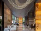 Luxurious open-concept lobby with modern furniture and chandelier