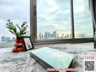 High-rise room view with decorative elements by the window