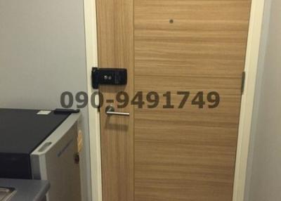 Wooden door entrance with electronic lock