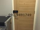 Wooden door entrance with electronic lock