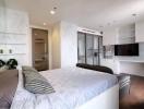 Modern bedroom with queen-size bed, built-in wardrobes, and ensuite bathroom