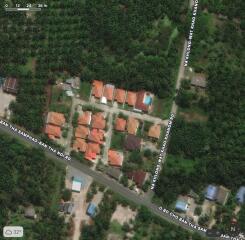 Aerial view of residential area with houses and greenery