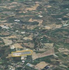 Aerial view of a sprawling area showing landscape and parcels of land