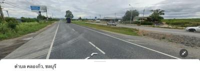 Paved road with clear sky and traffic signs