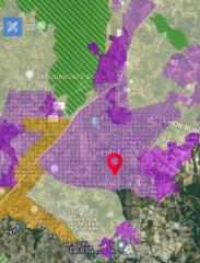 Map view showing the location of a property with various geographical areas marked in different colors