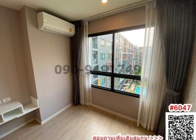 Bright and airy bedroom with a view, featuring modern air conditioning unit and elegant window treatments