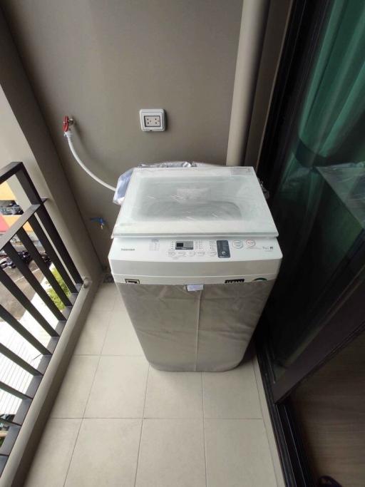 Compact laundry area with a new washing machine