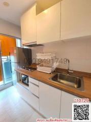 Compact modern kitchen with stainless steel sink