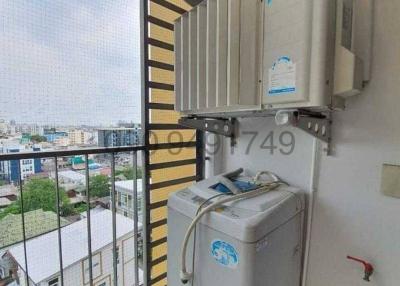 Compact balcony or utility area with installed air conditioning units and water heater