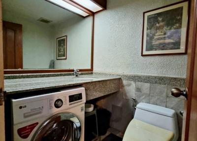 Compact bathroom with laundry appliances