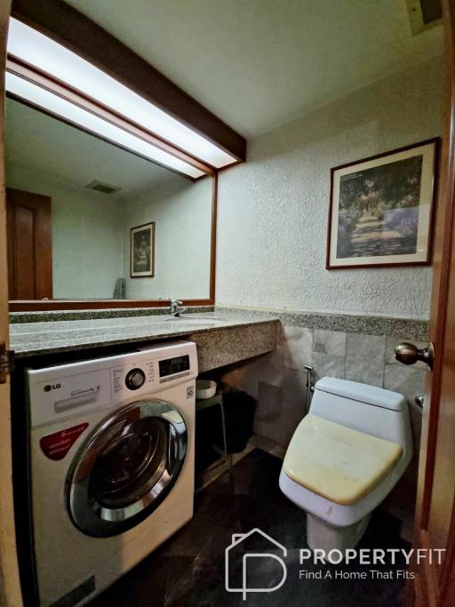 Compact bathroom with laundry appliances