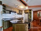 Spacious kitchen with modern appliances and wooden cabinets