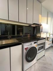 Modern kitchen with integrated appliances and glossy cabinets