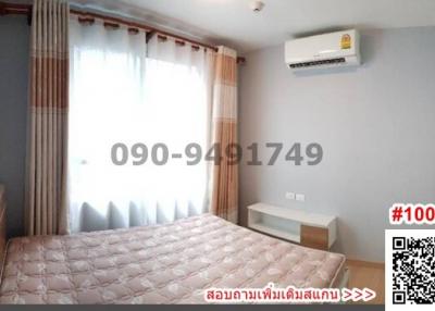 Cozy bedroom interior with large window and air conditioning unit