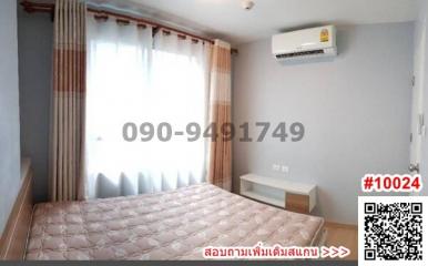 Cozy bedroom interior with large window and air conditioning unit