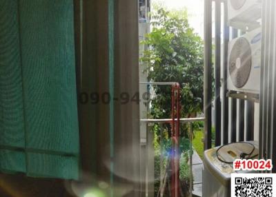 Cozy balcony with outdoor fan and greenery view