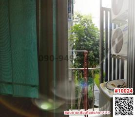 Cozy balcony with outdoor fan and greenery view