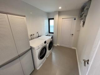Modern laundry room with washer and dryer
