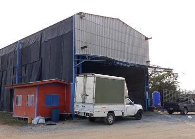 Industrial warehouse with exterior office space and loading truck