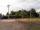 Rural house exterior with land and vegetation