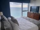 Ocean view bedroom with large windows