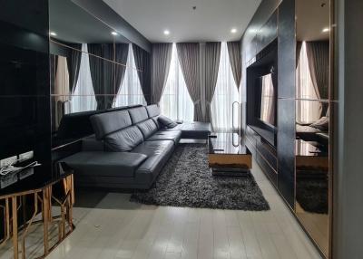 Modern living room with large sectional sofa and sleek design