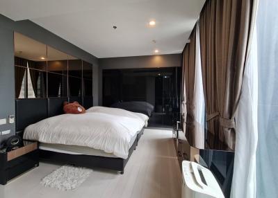 Spacious bedroom with modern design and large windows