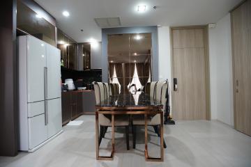 Modern kitchen with dining area and integrated appliances