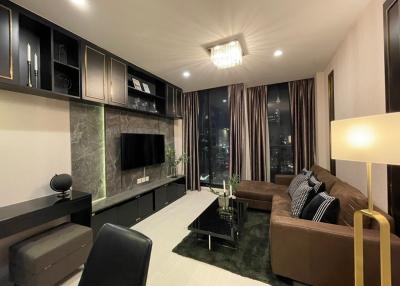 Modern living room interior at night with city view