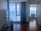Coastal bedroom with ocean view and balcony access