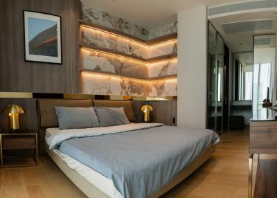 Modern bedroom with stylish lighting and marble wall design