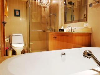 Modern bathroom interior with bathtub and glass shower
