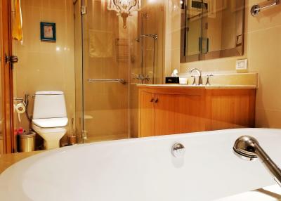 Modern bathroom interior with bathtub and glass shower