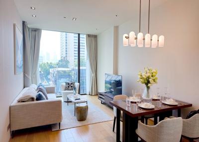 Modern living room with dining area and large windows