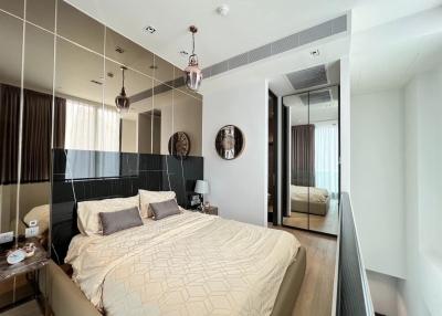 Modern bedroom with queen-sized bed and en-suite bathroom