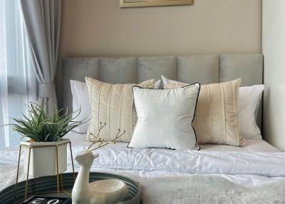 Cozy bedroom with elegant decor and plush bedding