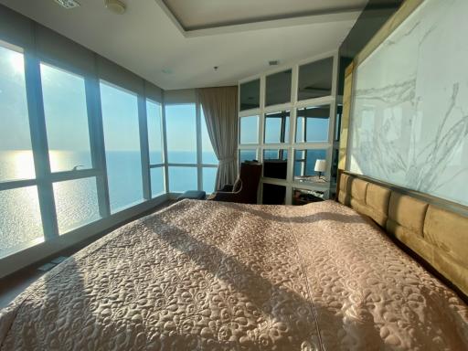Spacious bedroom with a panoramic sea view and ample natural light