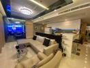 Spacious living room with open kitchen design, sectional sofa, and modern amenities