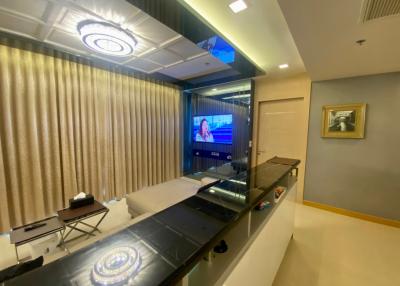 Elegant living room interior with modern lighting and entertainment setup
