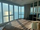 Modern bedroom with large windows overlooking the sea