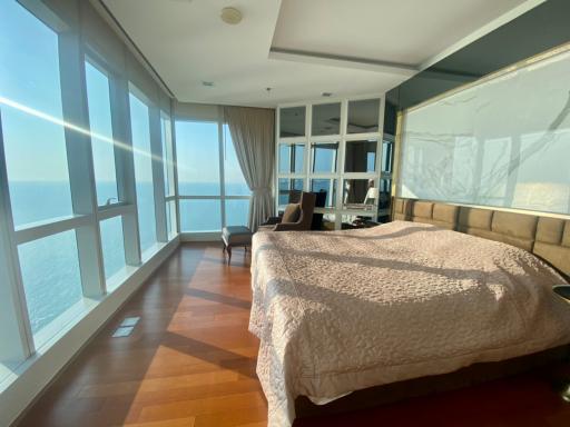 Spacious bedroom with natural light and sea view