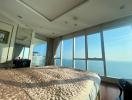 Spacious bedroom with a large bed and panoramic sea view