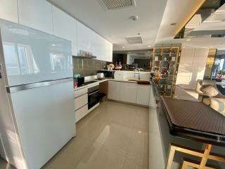 Modern kitchen with clean design and fully-equipped interior