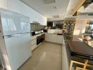 Modern kitchen with clean design and fully-equipped interior