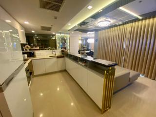 Modern kitchen with white cabinets and integrated appliances